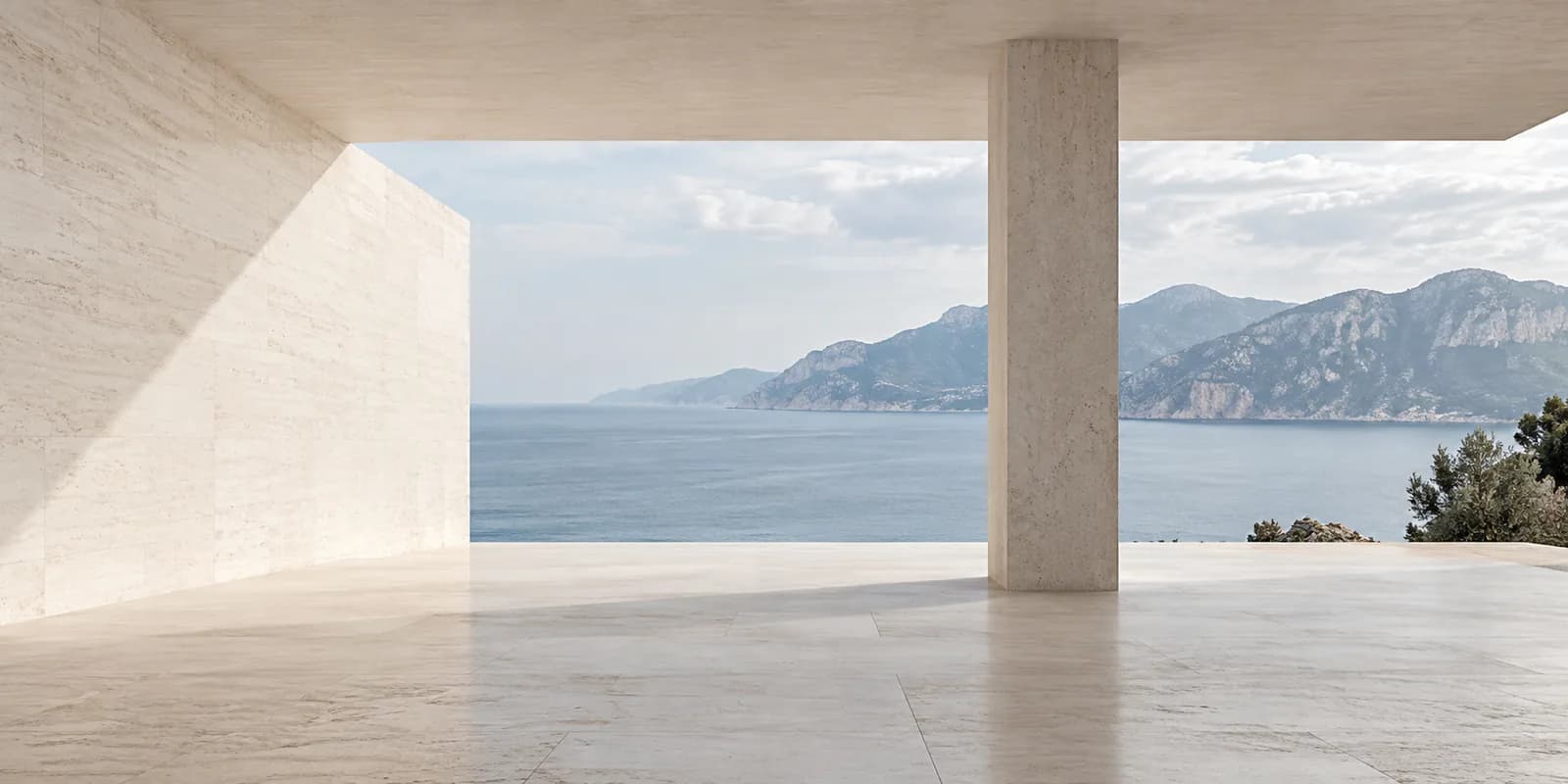 Sunlit stone architecture opening onto the sea