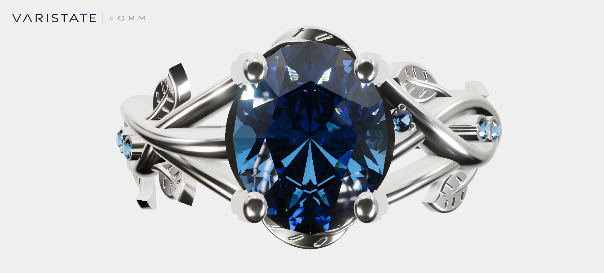 Front view of a blue sapphire centre stone held by pale-metal prongs with smaller blue stones along the ring band